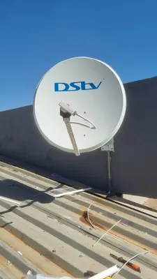 Dish bracket fixed through a corrugated metal roof sheet
